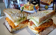 Eating a sandwich.